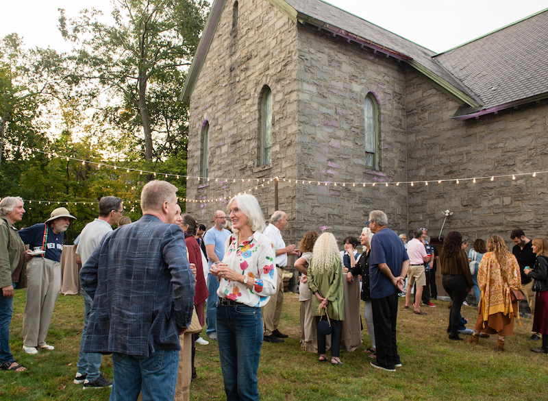 Groups of people standing on The Granite lawn